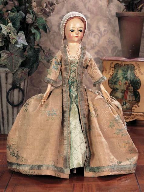 Delight In The Charm Of A Wooden Colonial Doll