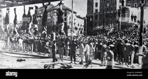 Photograph of the hanging bodies of Mussolini and Petacci in the ...