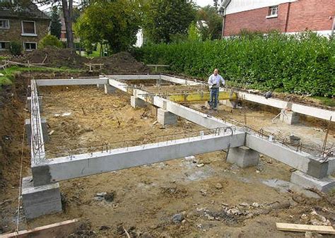 A Man Standing In The Middle Of A Construction Site With Cement And