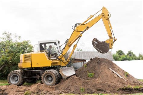 A Excavator Is Digging On Outdoors In An Industrial Site Excavation