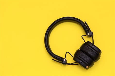 Premium Photo | Fashion wireless headphones on yellow