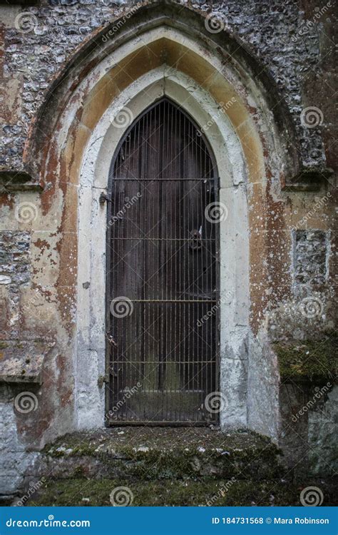 Old Gothic Arched Door With Wooden Door In A Stone Wall Editorial Stock