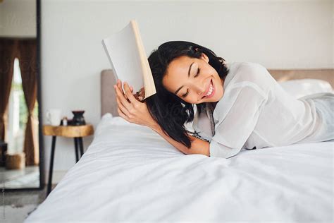 Woman Reading A Book In The Morning By Stocksy Contributor Lumina