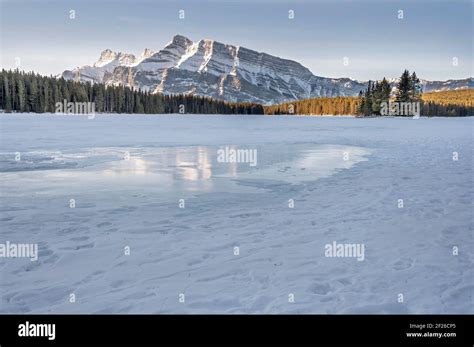 Ice Reflection Of Mount Rundle In Two Jack Lake In Banff National Park