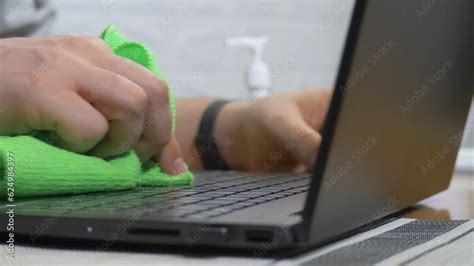 Office Male Worker Using Spray Disinfection Gel Sanitizing And Wiping