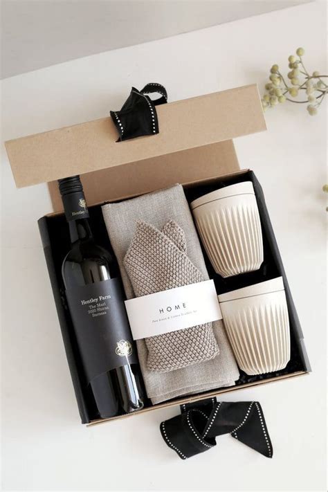 A Wine Bottle Napkins And Other Items In A Box