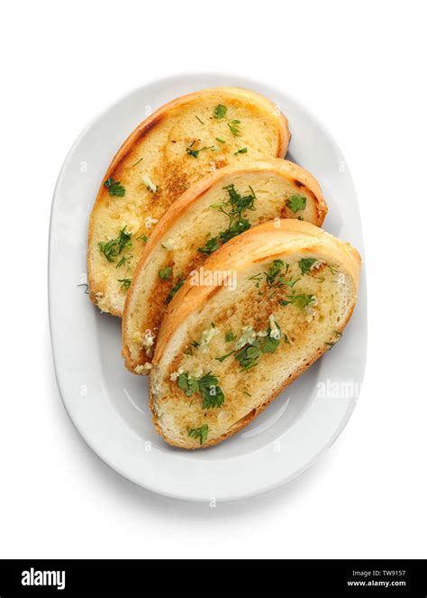 Plate With Delicious Homemade Garlic Bread Isolated On White Stock