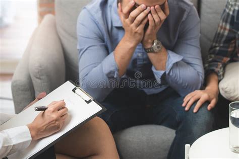 Psychologist Talking With Married Couple About Depression Of Husband