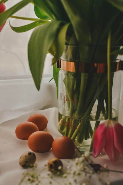 Premium Photo Easter Still Life With Eggs And Tulips