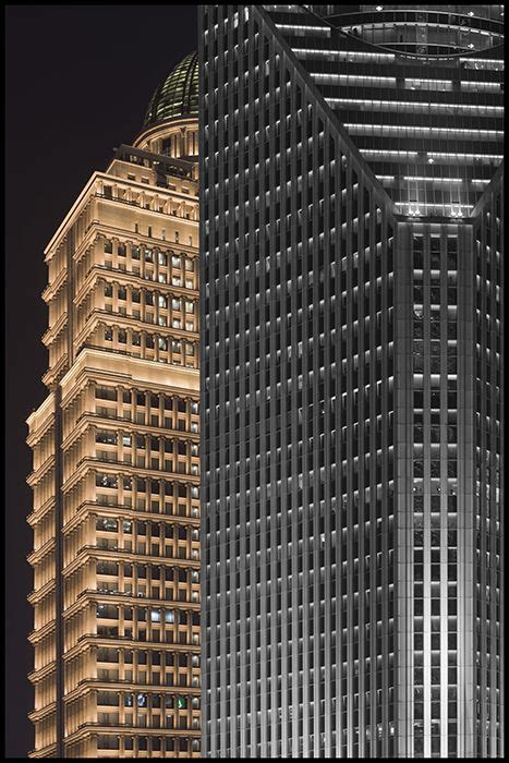 Two Tall Buildings Are Lit Up At Night