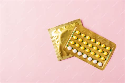 Premium Photo Condom In Wrapper Pack And Contraceptive Pills Blister