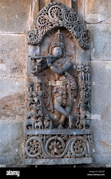 Stone Sculpture of Hindu God Krishna with selective focus, 12th century Hindu temple, Ancient ...