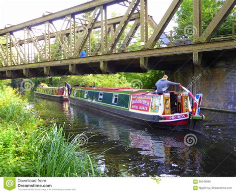 Narrowboat Passing Under Steel Girder Bridge Editorial Stock Image