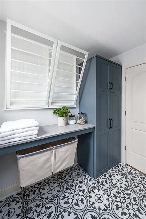 Blue Laundry Room Cabinets With Black And White Cement Floor Tiles