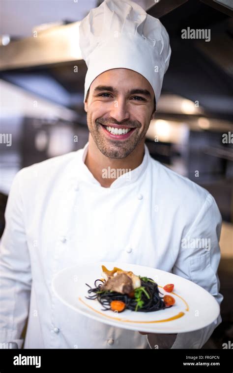 Handsome Chef Presenting Meal Stock Photo Alamy