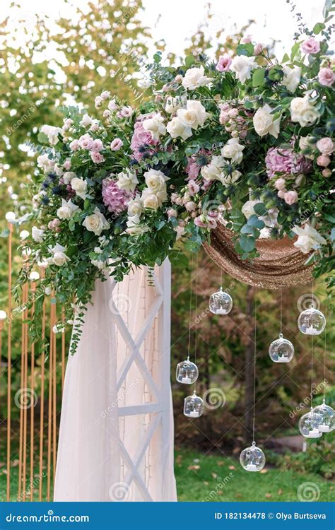 Arch For The Wedding Ceremony Decorated With Cloth And Flowers Stock