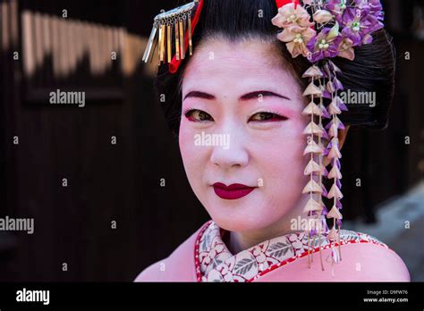 Traditionally Dressed Geishas In The Old Quarter Of Kyoto Japan Stock