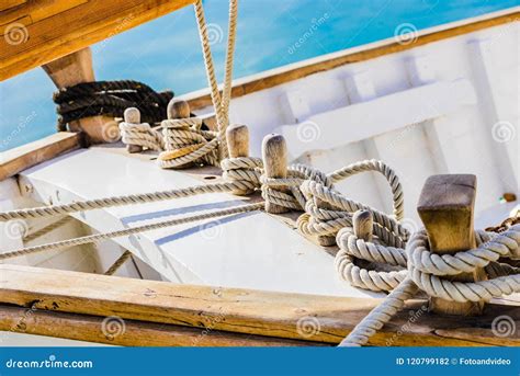 Classical Wooden Sailing Boat Deck With Tied Nautical Ropes On Wood