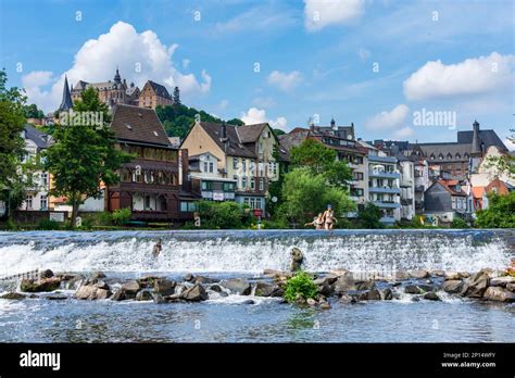 Marburg: river Lahn, bather at ground sill, houses, castle Marburger ...