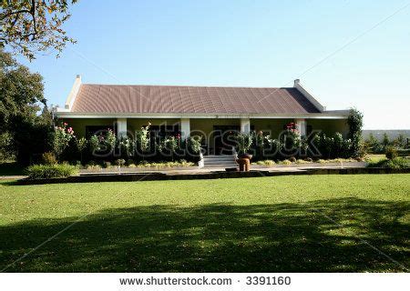 Old farm house viewed from the front, built in typical South African Africaner (Afrikaner) style ...