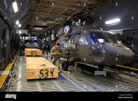 Ground Crews Prepare To Unload Us Army Uh 60 Black Hawk Helicopters