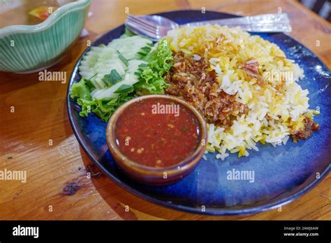 Beef Biryani Stew Beef With Yellow Rice Serve With Spicy Sauce On Side