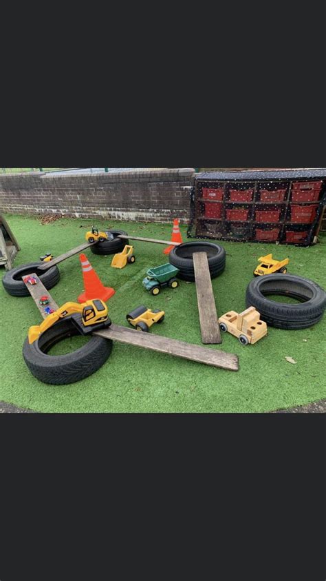 Toy Cars And Construction Equipment On Artificial Turf