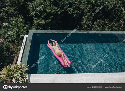 Sexy Woman In Bikini Enjoying Summer Sun In Swimming Pool Stock Photo