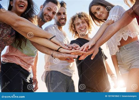 Happy Group Of Friends Holding Hands Together Outside Stock Image