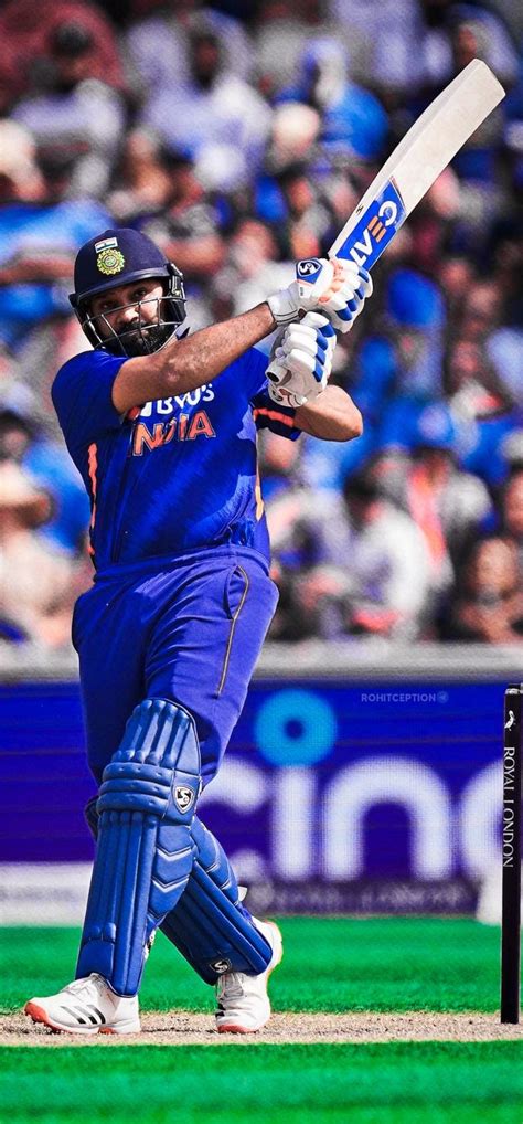 a man swinging a cricket bat on top of a field