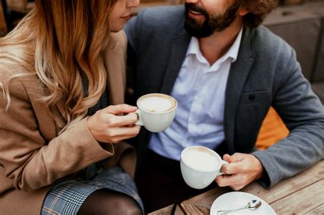 Free Photo Elegant Couple In Love Sitting In A Cafe Drinking Coffee