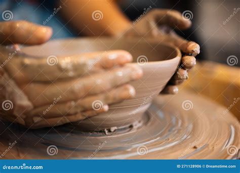 Close Up On Skillful Hands Sculpting Pottery Jar On Potter Wheel Stock