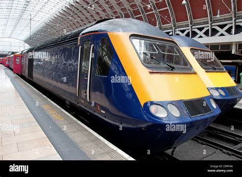 Two trains at a railway station Stock Photo - Alamy