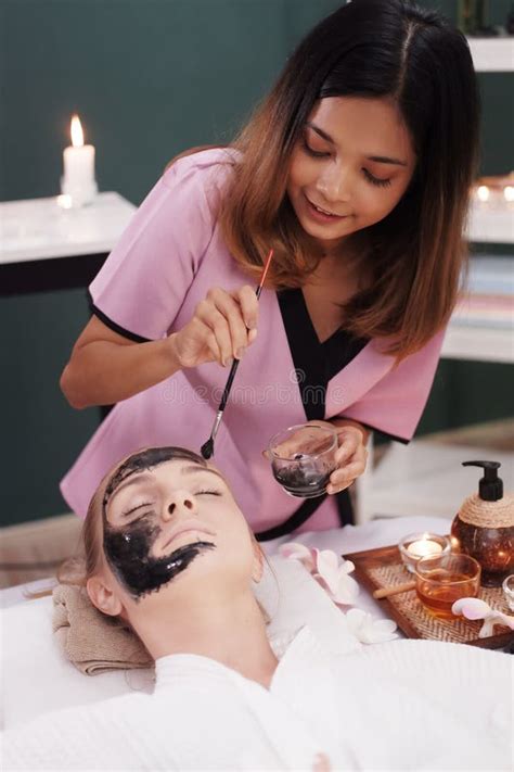 Smiling Professional Asian Thai Massage Therapist Woman Is Making