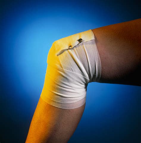 View Of A Bandaged Knee Photograph By Tek Image Fine Art America