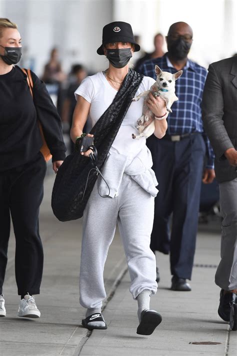 Kaley Cuoco - Arrives with her dog at JFK Airport in New York-06 | GotCeleb