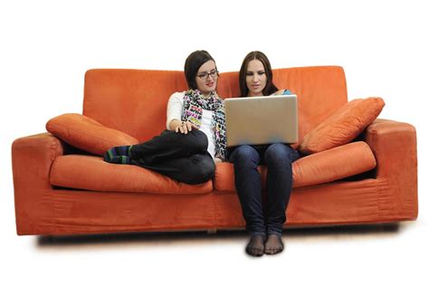 female friends working  laptop computer  home  stock photo