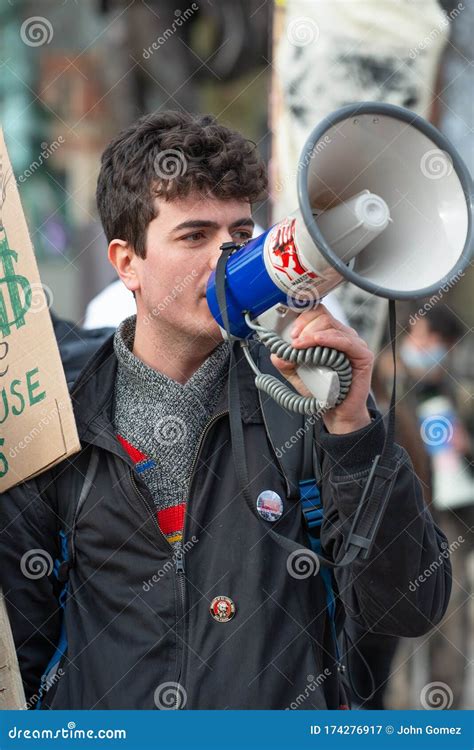 Youth Activist With Megaphone At The Climate Change Demonstration In