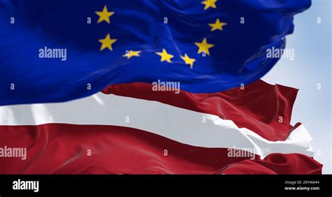 Flags Of Latvia And The European Union Waving Together Stock Photo Alamy