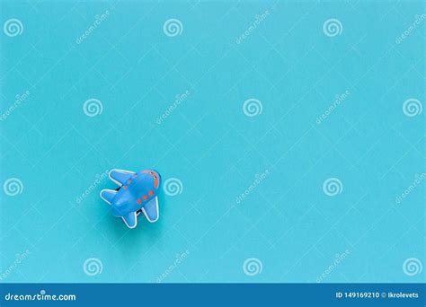 Children`s Funny Toy Plane on Blue Paper Background. Copy Space Top ...