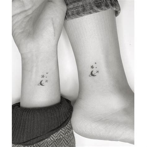 Minimalist matching airplane, moon and star tattoo for