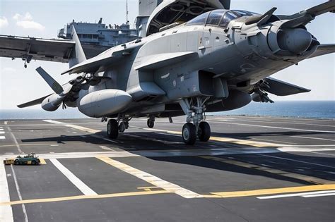 Premium Photo | Helicopter on the aircraft carrier Parked Taking off and Landing