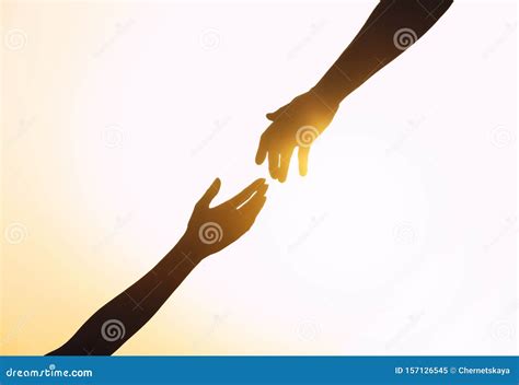 Silhouettes Of Man And Woman Helping Each Other Against Sunset Stock Image Image Of Buddy