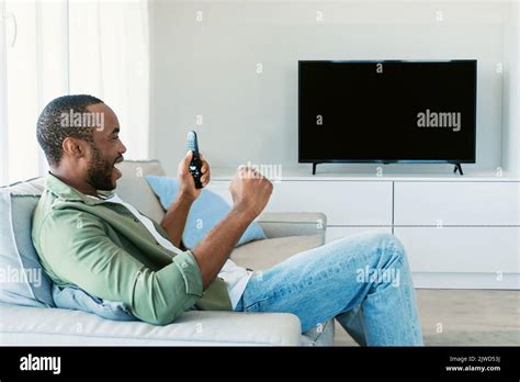 Excited Black Man Watching Sport Television Channel Cheering Favorite