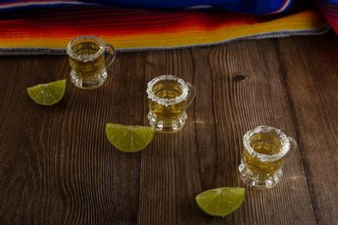 Premium Photo Tequila Shots With Salt And Lime On A Bar Table Shots