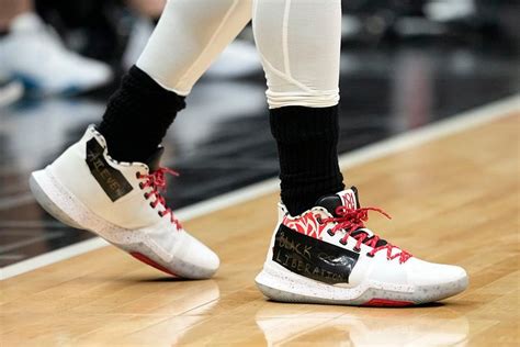 What did Kyrie Irving write on his Nike shoes for first game with ...