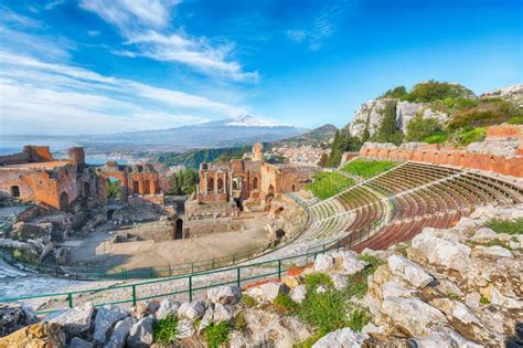 Ruins Of Ancient Greek Theater In Taormina And Etna Volcano In The