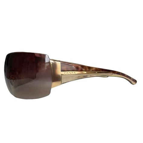 Prada Logo Shield Sunglasses In Brown Gold Nitryl