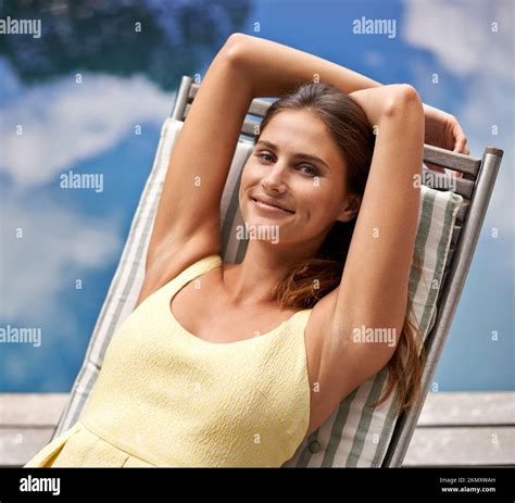 This Is My Dream Job A Beautiful Woman Relaxing On A Deck Chair Next