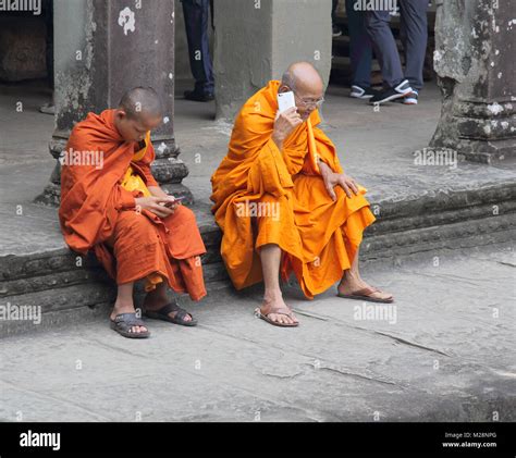 Buddhist Monks At The Ancient Temple Of Angkor Wat At Siem Reap